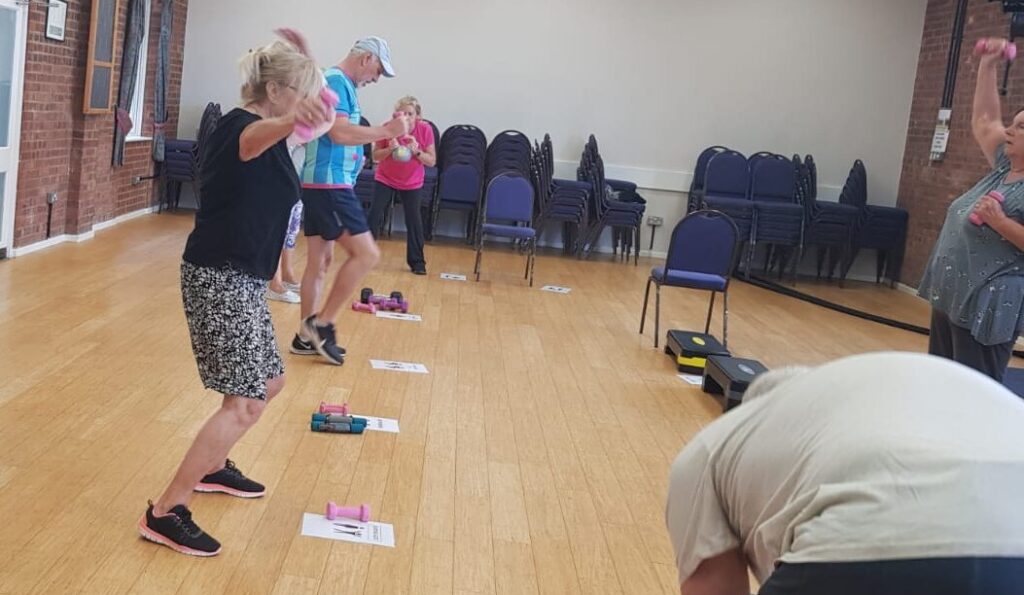 Age Activity Club members taking part in a group session